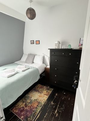 The private guest room features a standard double bed (1.4m wide), a chest of drawer and in summer cooling blanket and small evaporative fan to keep cool for comfort.  at London Vegan Host in North London