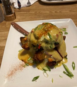 Red Pepper and Spinach-stuffed Portobello mushroom with smoked vegan Gouda  at Issac's Way in Fredericton