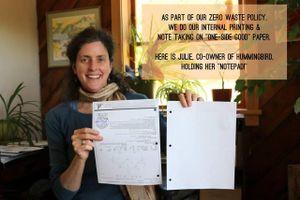 Owner Julie tilt reuses printing paper for her notepad  at Hummingbird Wholesale in Eugene