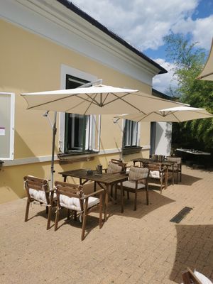 Tables in the garden at Govinda in Eger