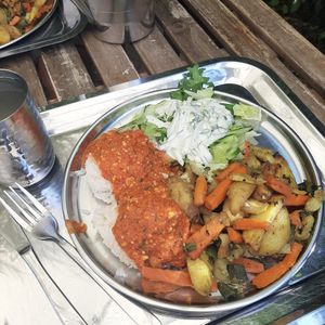 Salad with tzatiki, rice, tomato sauce with spices, tofu and roasted veggies at Govinda in Eger