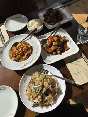 GF Ho Fun Noodles & Shiitake mushrooms & tofu in spicy sauce (front), Mapo tofu, dongbei style potato & aubergine (left & top right)  at Tofu Vegan in Brighton