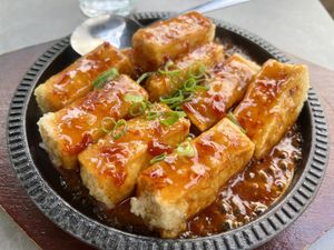 Sizzling tofu in house special sauce   at Tofu Vegan in Brighton
