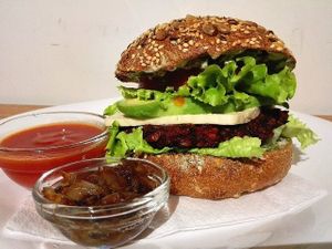 The best vegan burger in town! Slowly fermented sourdough bun, 2 types of treenut cheese, homemade ketchup, homemade mustard, caramelized onions and patty made of beet, lentils and brown rice make this buddy a real 'slow food' masterpiece! at Soma Vital Food in Sofia