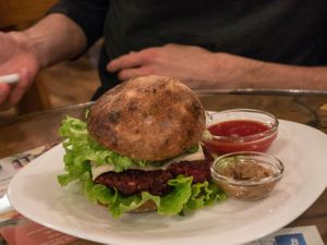 The best vegan burger in town! Slowly fermented sourdough bun, 2 types of treenut cheese, homemade ketchup, homemade mustard, caramelized onions and patty made of beet, lentils and brown rice make this buddy a real 'slow food' masterpiece! at Soma Vital Food in Sofia