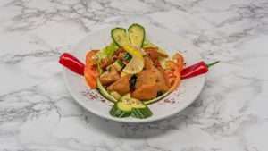 Fresh fattoush salad with mixed vegetables, herbs and crispy bread pieces, dressed with tangy pomegranate molasses at Damastique in York