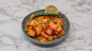 Spiced Syrian hot potatoes sautéed with garlic, herbs and chilli. A delicious vegan side dish with authentic flavours. at Damastique in York