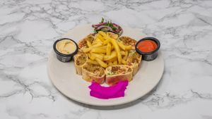 Authentic Syrian falafel wraps served with hummus, crispy fries and fresh salad. Enjoy vegan-friendly Middle Eastern flavours in the heart of York. at Damastique in York