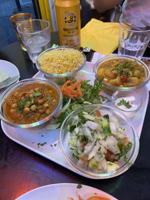 Chickpea curry, cauliflower and potato curry, saffron rice and salad (part of The Persepolis Full Feast)  at Persepolis - Snackistan in South East London