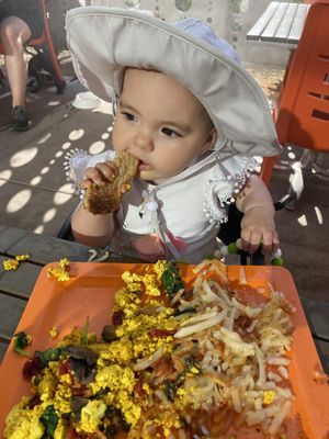 My daughter enjoying her toast!  at Scramble in Scottsdale