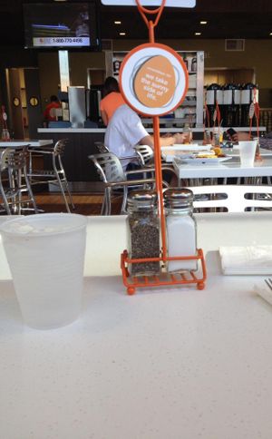 Condiments & drinks area in the center at Scramble in Scottsdale
