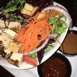 Flash/bad lighting doesn’t do this justice! Thai peanut bowl. I swapped spring greens for the slaw it was supposed to come with. The veggies were fresh, the sauces were so good!! at Louie's in Ashland