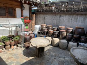 Fermenting jars in courtyard  at Maji - 마지 in Seoul