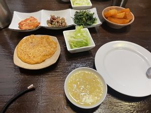 Side dishes, pancake, porridge and cooked radish  at Maji - 마지 in Seoul