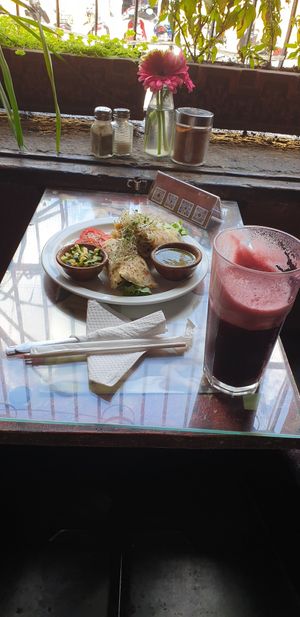 Vegan egg wrap and hibiscus basil water with a CBD shot at Samsara in Antigua
