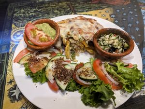 Sweet potato fritter. Option to change cheese to cashew cheese however includes eggs. I started to eat before I thought to take a photo. at Samsara in Antigua