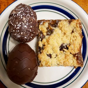 Carmelita (coconut crumble crust, coconut caramel, and chocolate chips) and 2 cream eggs (coconut cream and original). Photo taken April 2019. at Bunner's Bake Shop - Kensington in Toronto
