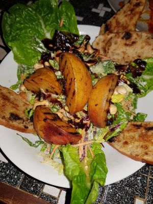 Caesar salad with grilled peaches  at The Vegan Eagle in Hamburg