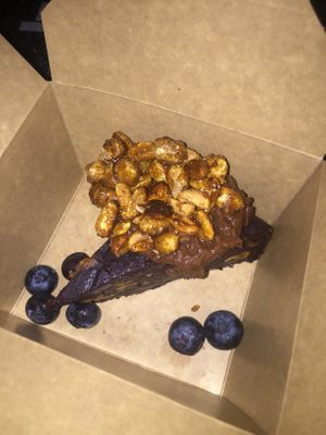 Brownie with chocolate cream and caramelized peanuts  at The Vegan Eagle in Hamburg
