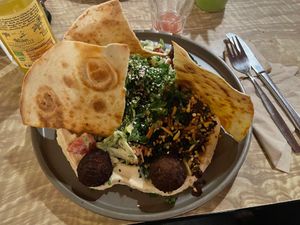 Hummus with lentil balls, lavash and salad at The Vegan Eagle in Hamburg