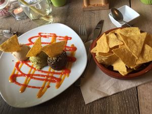 Tortillas with three dips, mango & Chilli sauce (aioli, pistachio, black bean)  at The Vegan Eagle in Hamburg