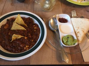 Five bean chilli and dips with tortilla, very tasty smoky beans at The Vegan Eagle in Hamburg