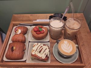 Cinnamon roll, salty pastry with pesto, mozzarella and tomatos, pain swiss and fiocco at Sementis Bakery in Pietrasanta
