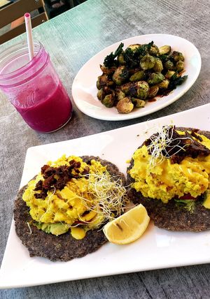 Eggs Benedict, glazed brussel sprouts and pitada and mango smoothie. at Trilogy Sanctuary in La Jolla