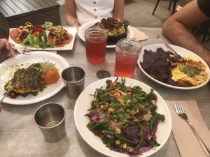 Lots of food with friends: miso bowl, mac n cheese, tacos and more...  at Trilogy Sanctuary in La Jolla