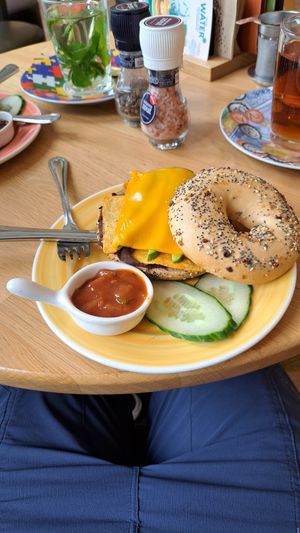 Tex Mex Bagel with pinto bean spread, melted "cheddar", avocado and nachos at Bagels & Beans - Plaats in The Hague
