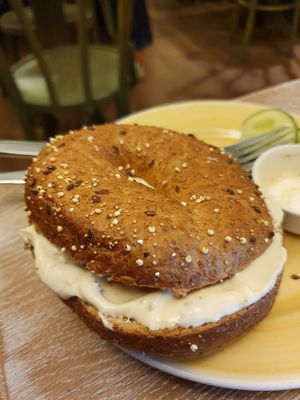Whole wheat bagel with vegan red paprika cream at Bagels & Beans - Plaats in The Hague