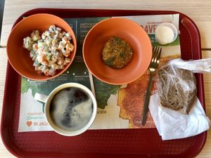Olivye salad, cabbage and carrot burger, slice of bread, Americano at Jagannath na Tverskoy in Moscow