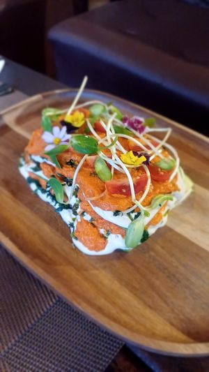 Raw lasagna made with zucchini tomato caviar cashew cream sauce spinach sproot basil at Soul Garden in Koh Phangan
