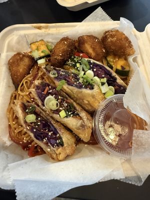 Jungle hibachi with egg rollss  at The Green Ape Gourmet Vegan in Chicago