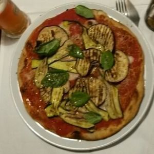 vegan Pizza with vegan cheese and grilled vegetables at La Colubrina in Milan