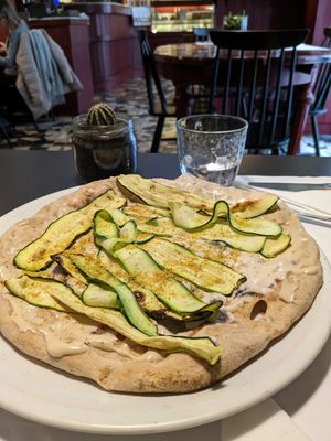 Focaccia with zucchini and tahini at La Colubrina in Milan