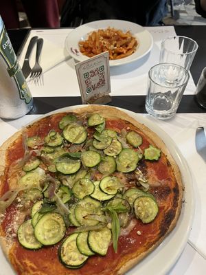 Pizza and pasta arrabiata  at La Colubrina in Milan
