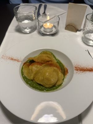 ravioli ripieni di yuca e batata, su cremoso di cime di rapa e broccoletti, polvere di peperoncino dolce  at La Colubrina in Milan