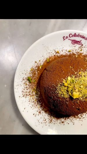 Cocoa, pistachio, coconut and hazelnut truffle at La Colubrina in Milan