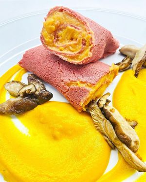 Cannelloni filled with yuca and yam cream, served with carrot béchamel and crispy shiitakes at La Colubrina in Milan