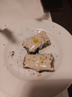 Half-eaten truffle bruschetta at La Colubrina in Milan
