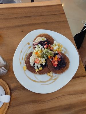 Pancakes 🥞 with Tropical Butter 🌴, Maple Syrup 🍁 and Fresh Fruit 🥝🍓🫐🍏 at Wild Beets in Ibiza