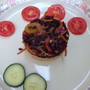 Duo of black and basmati rices - similar but simpler than a risotto, with onions, tomatoes, and pickled cabbage. Finished with lime juice at Bio Sound System in Venice