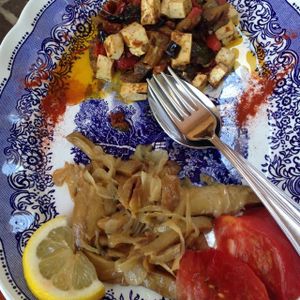 Seitan Venezia (Ventian style) pictured on bottom, tofu with roasted veggies on top portion of the photo at Bio Sound System in Venice