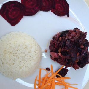 Sautéed spinach and beets with raisins and nuts, served with rice  at Bio Sound System in Venice