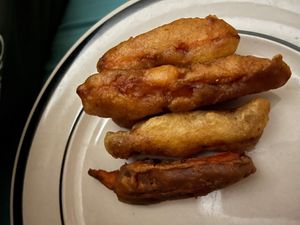 Sweet potato wedges with plum seasoning  at Kuan-Yin Vegetarian in Brisbane