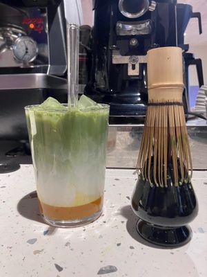Coco milk iced matcha with passion fruit purée  at Little Big cafe Rouen in Rouen