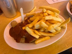 Sausage and fries  at Bergwolf in Munich