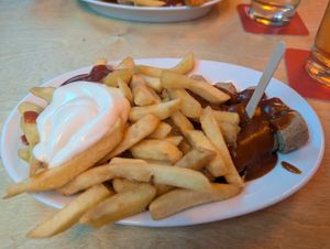 Vegan Currywurst with ketchup and mayo at Bergwolf in Munich