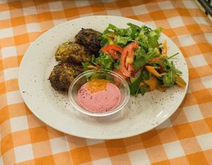 Herb Latkes: Root vegetables, leek, zucchini & sprouted mung beans, served with a fresh side salad & tahini-salsa at Nagila in Jerusalem